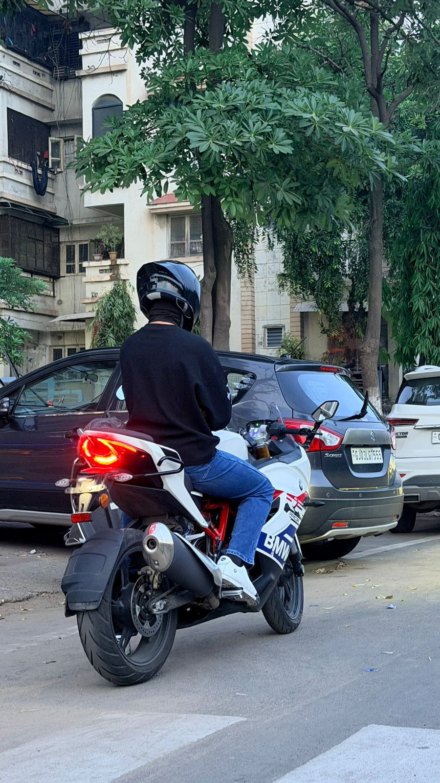 Dhruv Shukla photographed from behind on his motorcycle