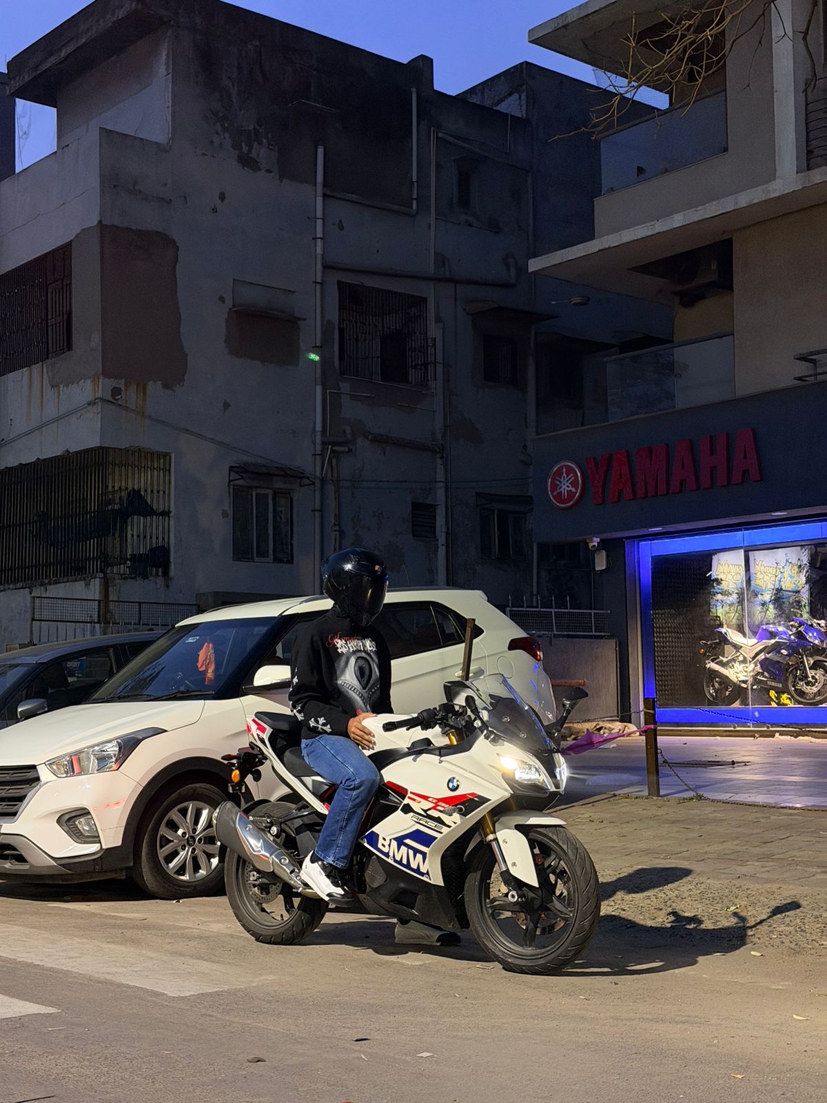 Dhruv Shukla seated on his motorcycle during an evening ride